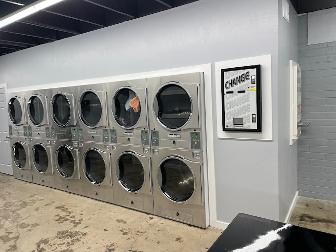 Row of large Huebsch high-capacity washers at PC's Wash & Go Burley